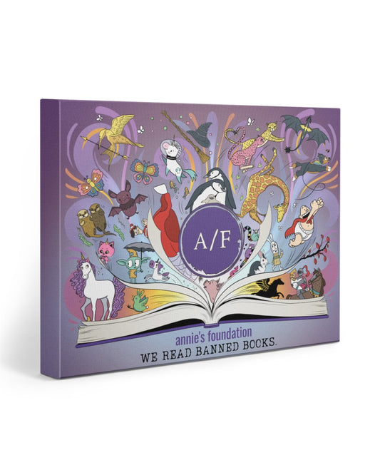 10" x 8" wrapped canvas Annie’s Foundation ‘We Read Banned Books’ artwork on purple background. Colorful, whimsical illustrations of memorable characters from beloved banned books rise from the pages of an open book with A/F logo at center.