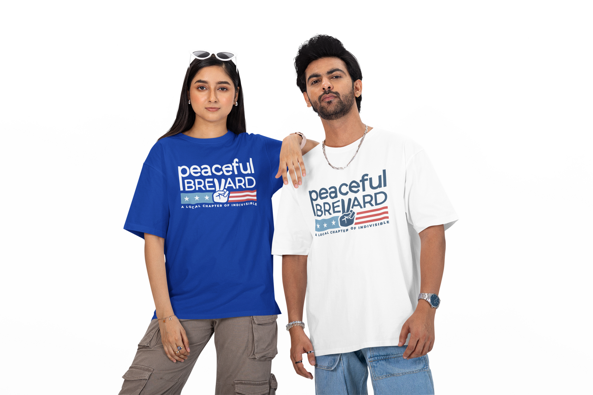 Two people wearing Peaceful Brevard unisex t-shirts in royal blue and white, featuring a pro-democracy design supporting local activism in Florida.