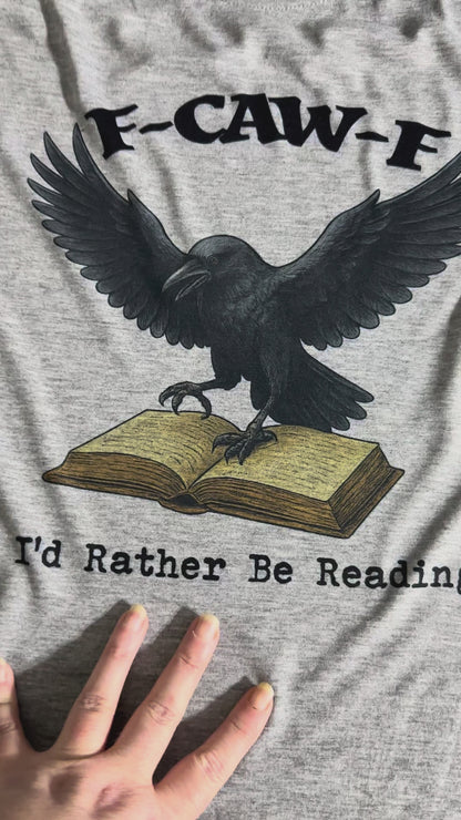 Video showing the F-Caw-F I'd Rather be reading original design sublimated onto atthetic heathered gray t-shirt