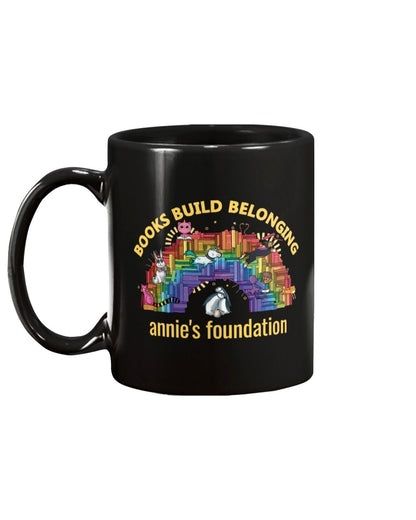 15 oz black mug featuring Books Build Belonging - Annie's Foundation pride collection