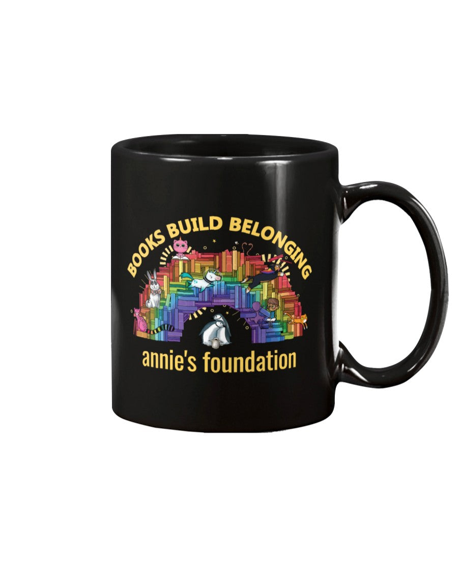 15 oz black mug featuring Books Build Belonging - Annie's Foundation pride collection