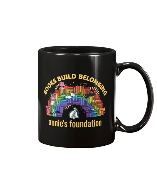 15 oz black mug featuring Books Build Belonging - Annie's Foundation pride collection