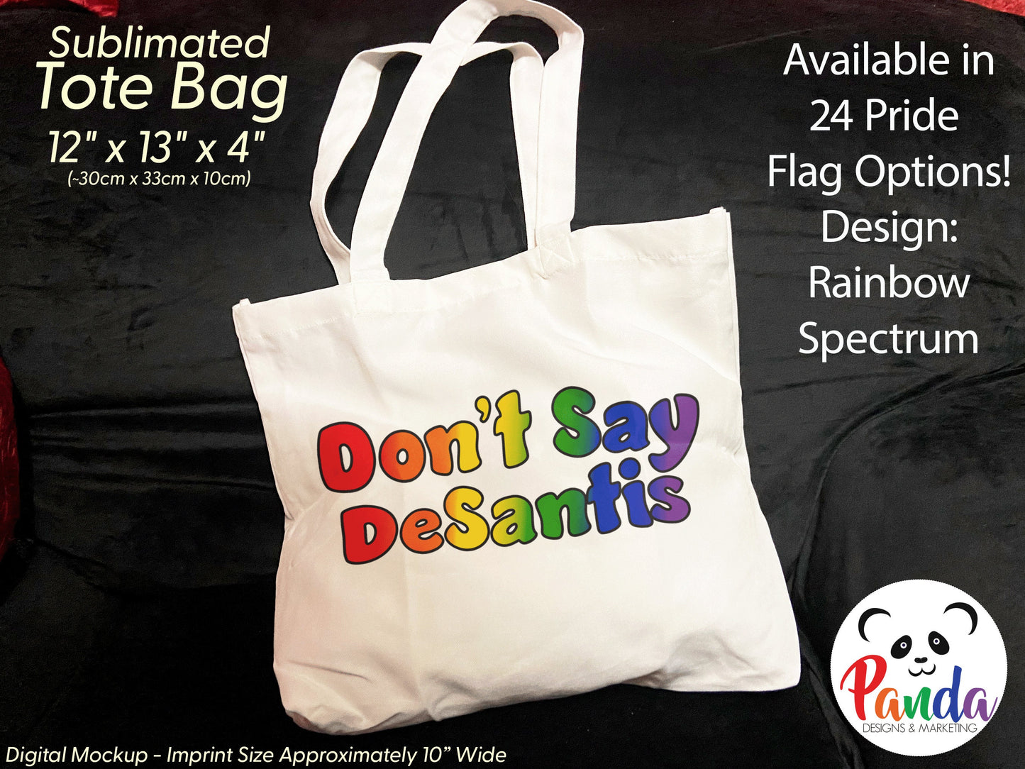 Photo of a white tote bag on a black velvet count. The back has "Don't Say DeSantis" in rainbow pride flag colors with black outline of fun shaped text